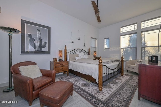 bedroom featuring light tile patterned floors and ceiling fan