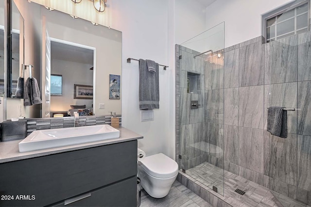 bathroom with an enclosed shower, vanity, and toilet