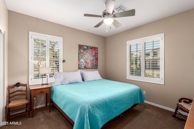 bedroom featuring baseboards, carpet floors, and a ceiling fan