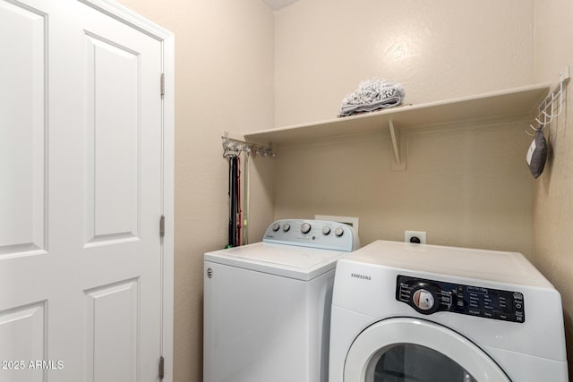 laundry area featuring laundry area and washing machine and clothes dryer