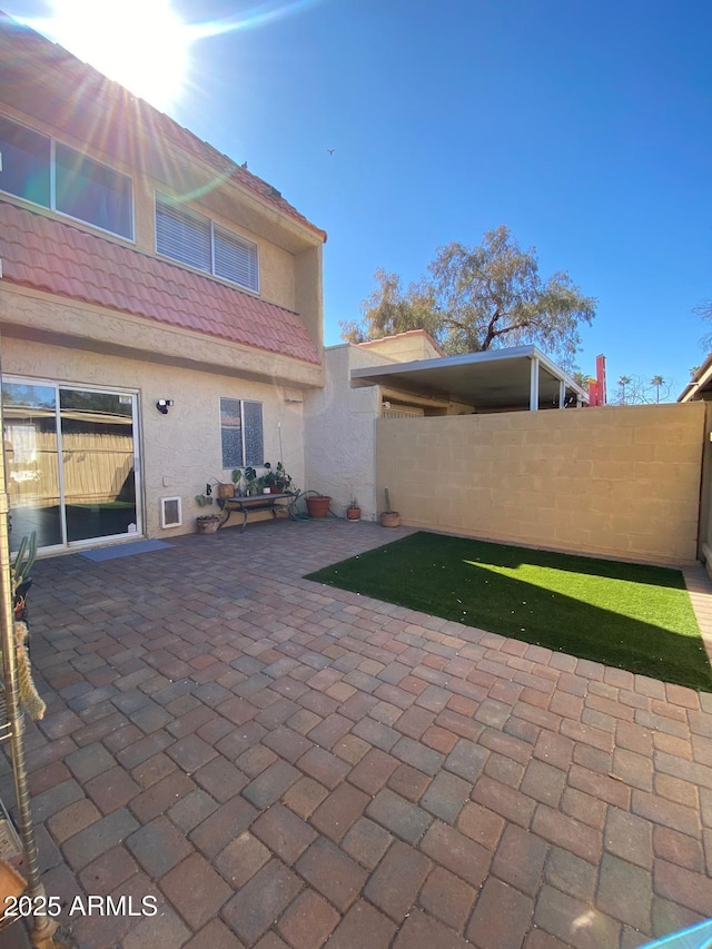 view of patio featuring fence