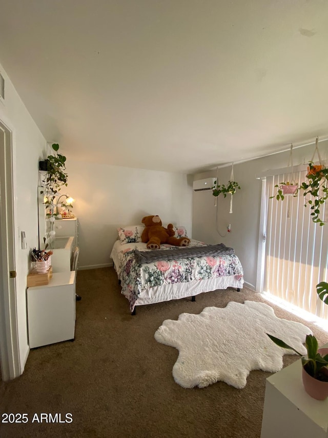 bedroom with dark carpet and a wall unit AC