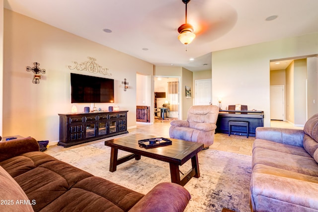 living area featuring recessed lighting, a ceiling fan, and baseboards