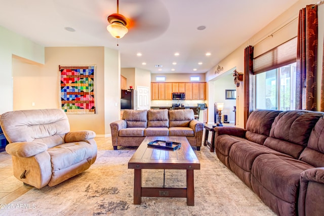 living room featuring recessed lighting and baseboards