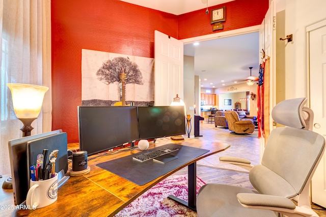 interior space featuring recessed lighting, a ceiling fan, and wood finished floors