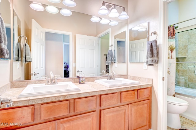 full bathroom featuring a sink, shower / bathing tub combination, toilet, and double vanity