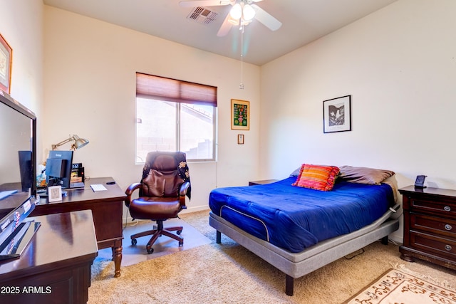 carpeted bedroom featuring visible vents and ceiling fan