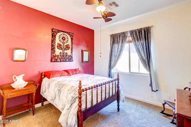 carpeted bedroom with baseboards, visible vents, and ceiling fan