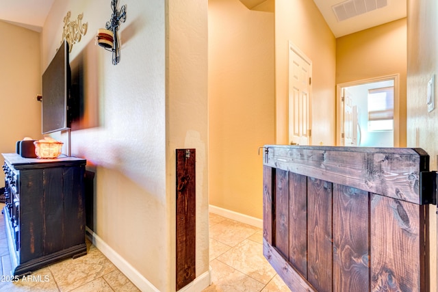 interior space with visible vents and baseboards