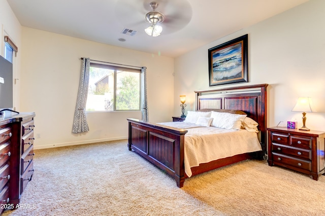 bedroom with light carpet, visible vents, a ceiling fan, and baseboards