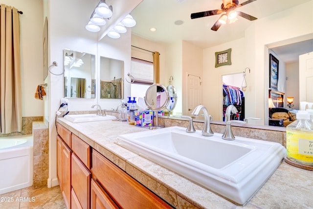 full bathroom featuring a sink, a ceiling fan, and double vanity