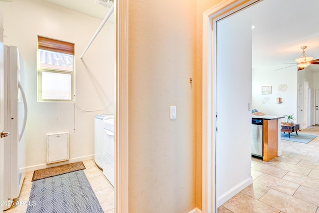 interior space with separate washer and dryer, visible vents, and baseboards