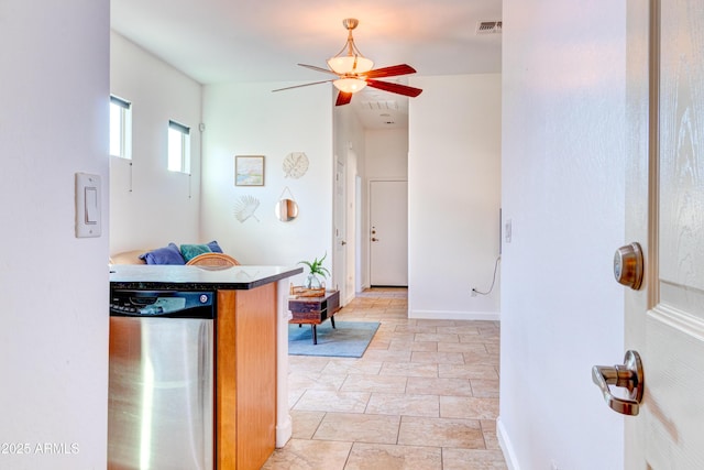 bathroom with baseboards, visible vents, and ceiling fan