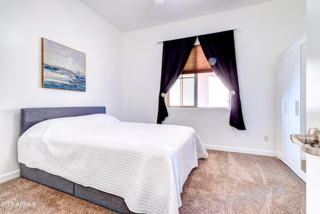 bedroom with baseboards and carpet floors