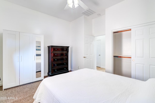 carpeted bedroom featuring baseboards, visible vents, and ceiling fan