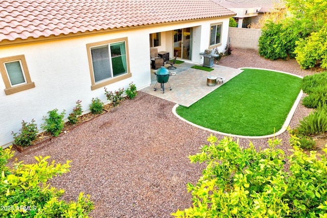 view of yard featuring fence and a patio area