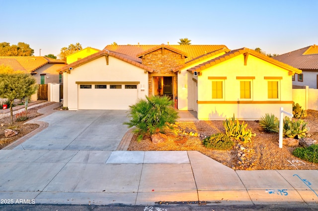 view of front of house with stone siding, stucco siding, concrete driveway, and a garage