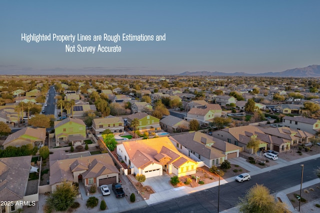 aerial view featuring a mountain view and a residential view