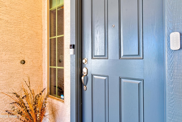 property entrance with brick siding