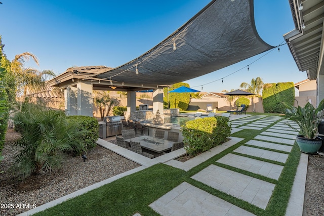 view of yard with area for grilling and a patio area