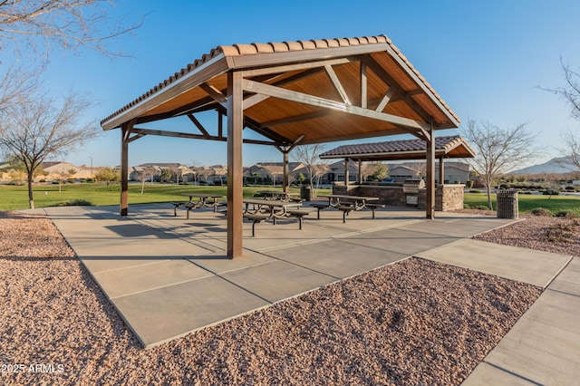 view of home's community featuring exterior kitchen, a gazebo, and a patio area