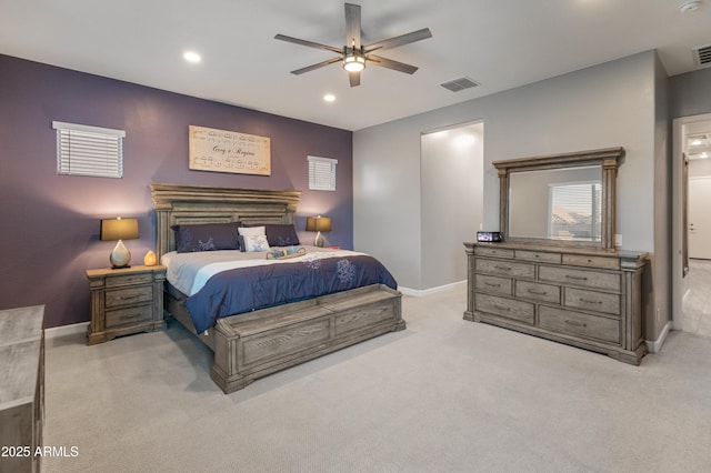 bedroom with ceiling fan and light colored carpet