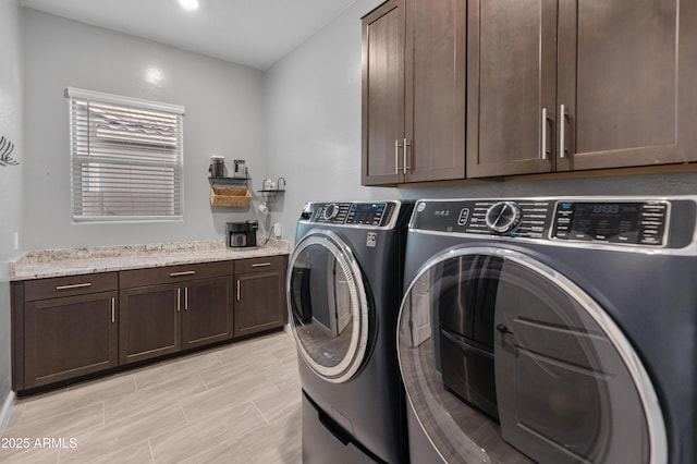 laundry area with cabinets and washer and dryer