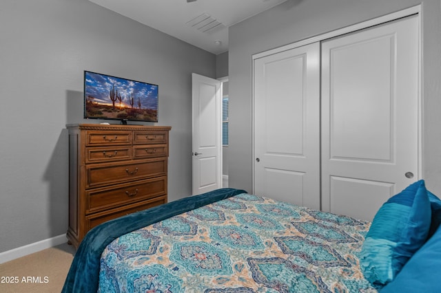 carpeted bedroom featuring a closet