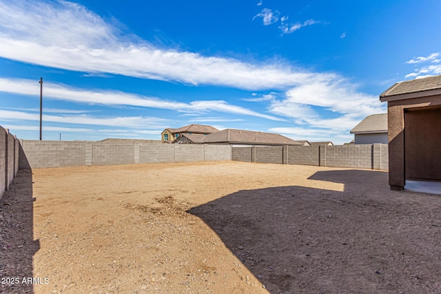 view of yard with a fenced backyard