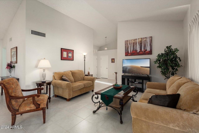 living room featuring high vaulted ceiling