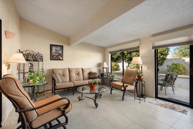 tiled living room with a textured ceiling and vaulted ceiling