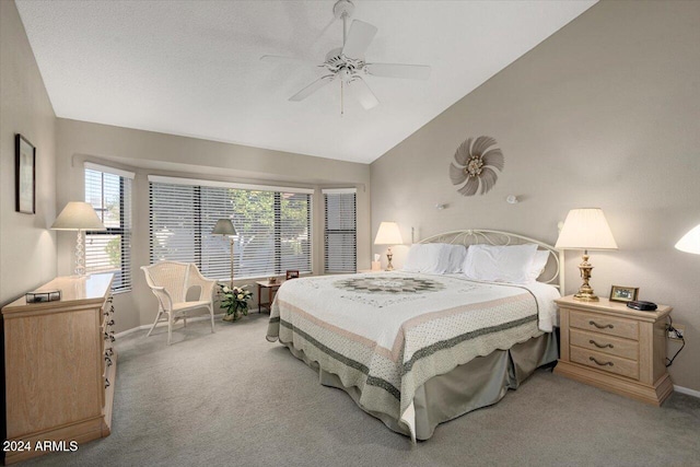 carpeted bedroom featuring ceiling fan and lofted ceiling