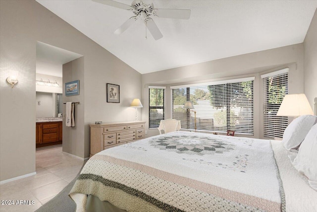 bedroom featuring connected bathroom, ceiling fan, light tile patterned floors, and lofted ceiling