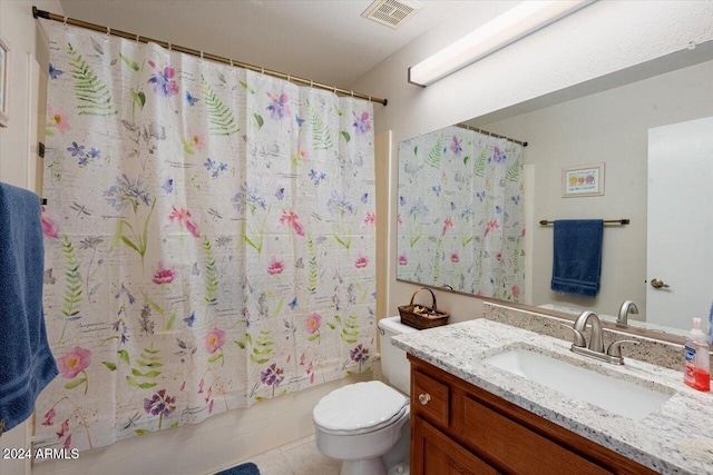 full bathroom with toilet, vanity, tile patterned floors, and shower / bathtub combination with curtain