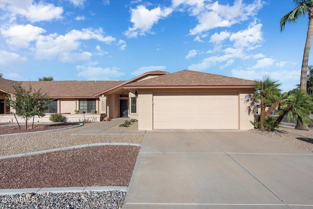 single story home featuring a garage