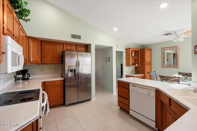 kitchen featuring ceiling fan, light tile patterned flooring, white appliances, and vaulted ceiling