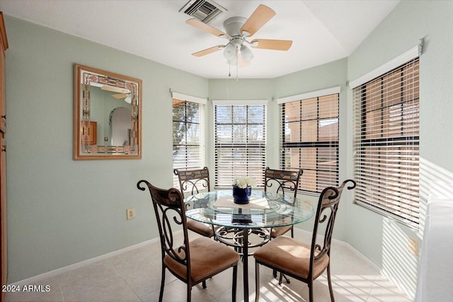 dining room with light tile patterned floors and ceiling fan