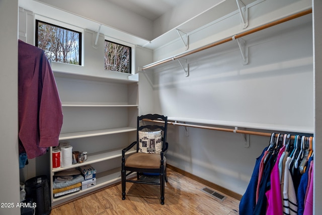 spacious closet with visible vents and wood finished floors