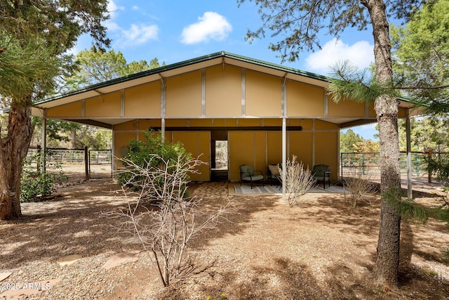 view of home's exterior with fence