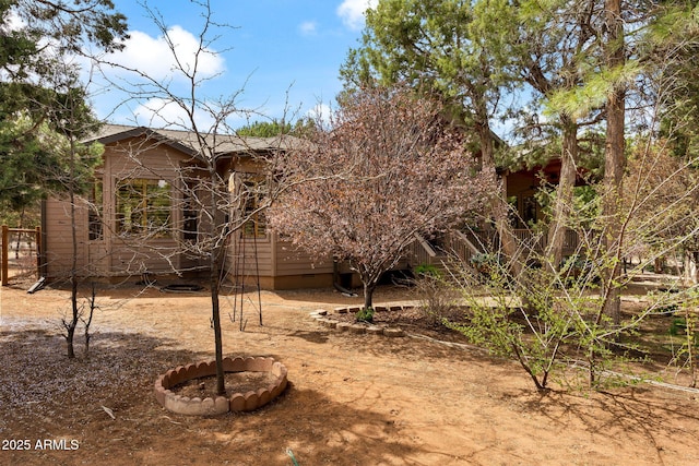 rear view of property with crawl space
