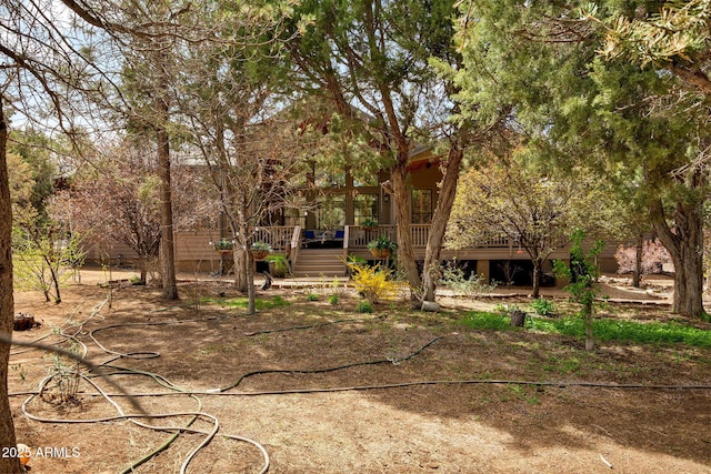 view of yard with a wooden deck