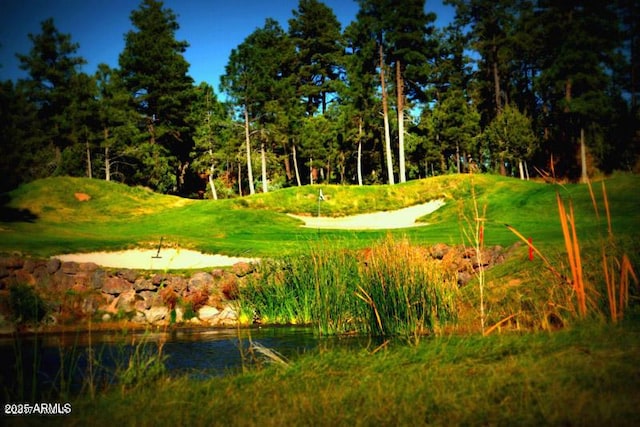surrounding community featuring view of golf course
