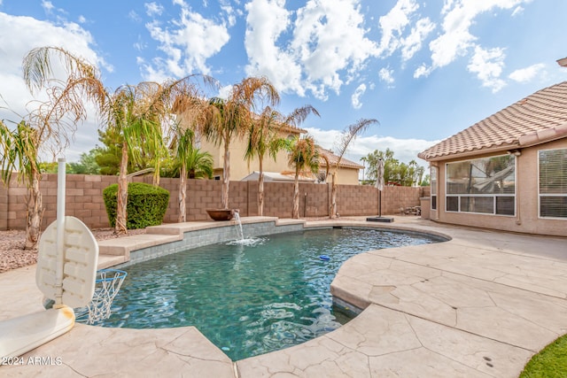 view of swimming pool featuring a patio area and pool water feature