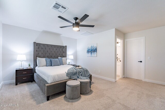 bedroom with light carpet and ceiling fan