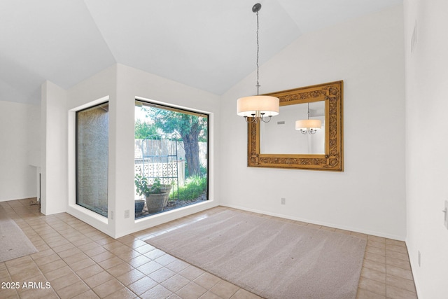 9797 N 100th Pl, Scottsdale, AZ 85258 - unfurnished dining area with lofted ceiling and tile patterned floors