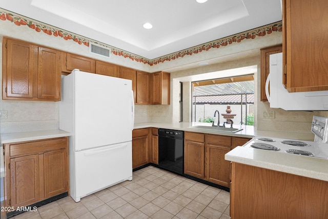 9797 N 100th Pl, Scottsdale, AZ 85258 - kitchen with white appliances, brown cabinets, light countertops, backsplash, and recessed lighting