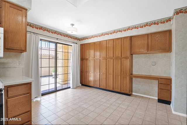 9797 N 100th Pl, Scottsdale, AZ 85258 - unfurnished dining area featuring light tile patterned flooring and baseboards