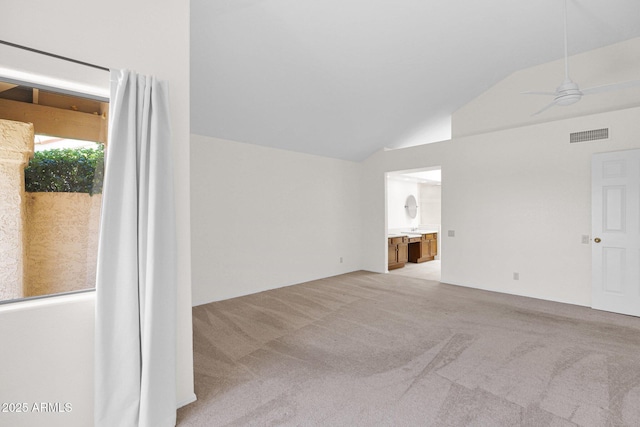 9797 N 100th Pl, Scottsdale, AZ 85258 - empty room featuring vaulted ceiling, light carpet, and a ceiling fan