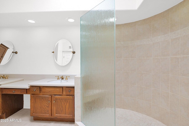 9797 N 100th Pl, Scottsdale, AZ 85258 - full bathroom featuring double vanity, a tile shower, tile patterned flooring, and recessed lighting