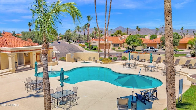9797 N 100th Pl, Scottsdale, AZ 85258 - community pool with a patio, a mountain view, and a residential view